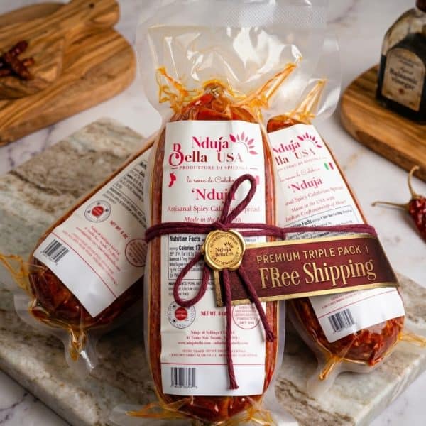 Pack of Nduja Bella spicy Calabrian sausage in clear vacuum-sealed bags.